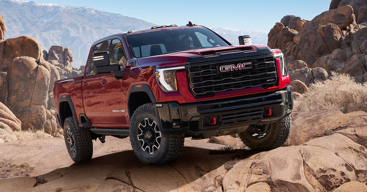 2025 GMC 2500 truck driving over rocks