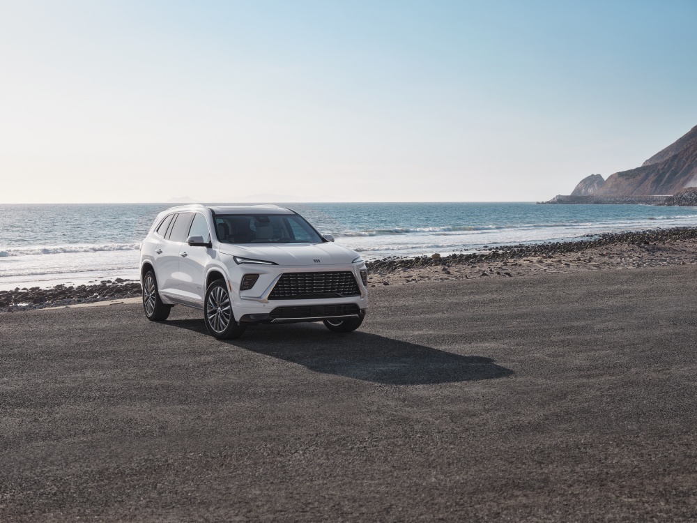 White 2026 Buick Enclave Avenir parked on a beach