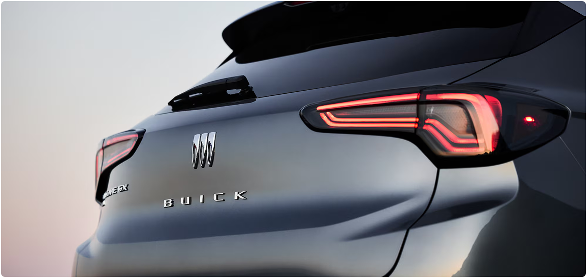 Rear quarter of a gray Buick Encore GX showing the taillamp and Buick lettering