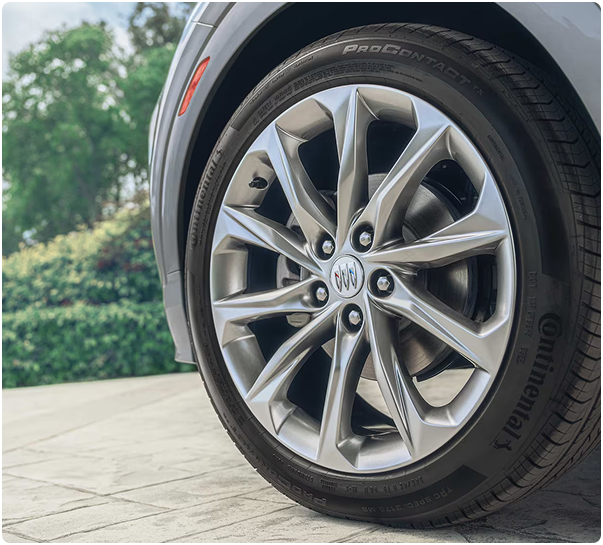 Close-up of a multi-spoke aluminum wheel with the Buick tri-shield center cap