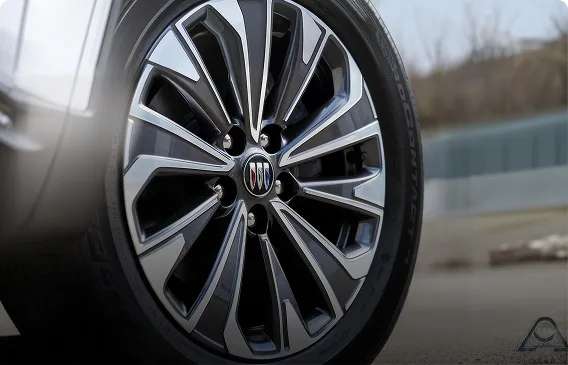 Close-up of an 18-inch machined alloy wheel with a Technical Gray finish on a Buick Envision