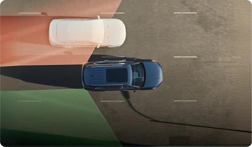 Overhead illustration of a blue Envision changing lanes with a red zone marking a vehicle in its blind spot