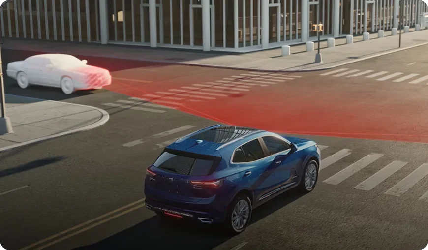 Blue Envision at a city intersection with a red zone marking a detected cross-traffic vehicle