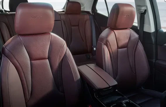 Burgundy perforated leather-appointed front seats with suede-like inserts inside the Envision Sport Touring