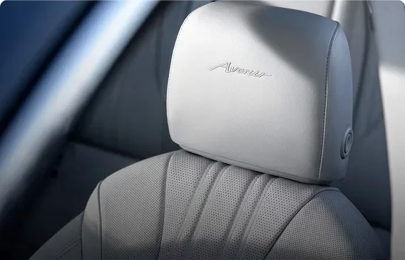 Light grey quilted perforated leather front seat with an Avenir-embossed headrest
