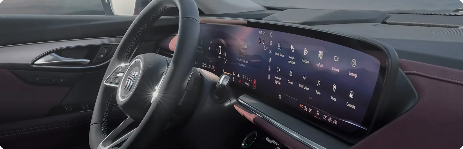 Buick Envision Sport Touring steering wheel and ultrawide display above a burgundy interior