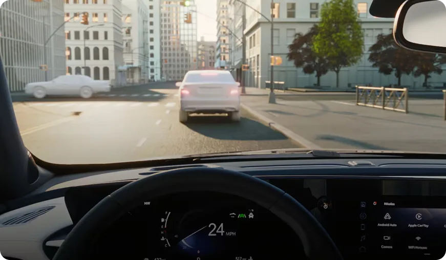 Driver's view through the Envista windshield of city traffic ahead with the speed shown on the cluster