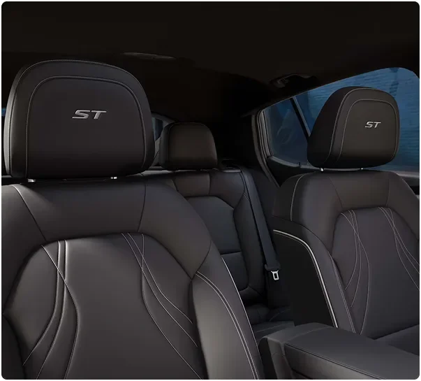 Black Sport Touring front and rear seats with ST headrests inside the Buick Envista
