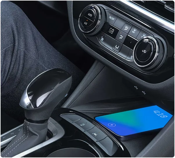 Phone charging on the wireless charging pad beside the Envista's gear selector