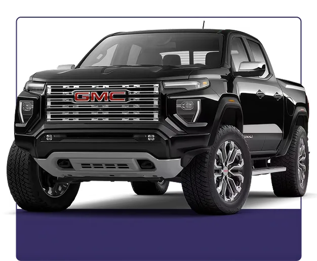 Black GMC Canyon Denali shown from the front three-quarter angle on a dark studio background