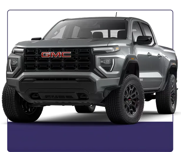 Silver GMC Canyon Elevation shown from the front three-quarter angle on a dark studio background