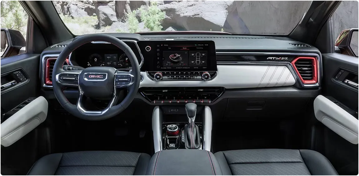 Wide view of the Canyon AT4X's dashboard and centre touchscreen with red accents