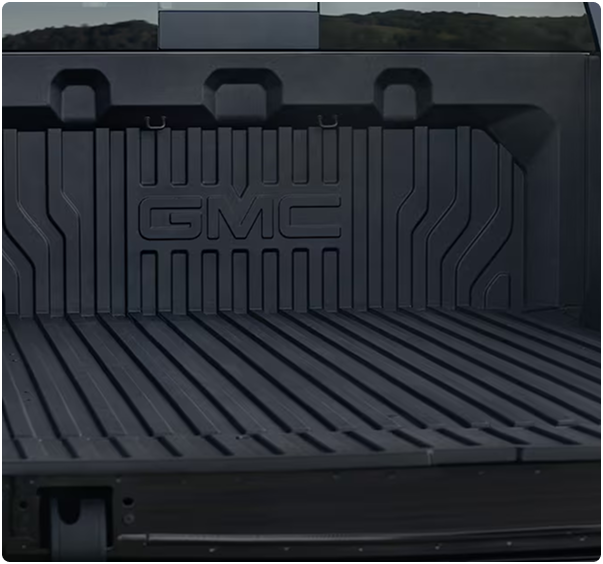 Close-up of the CarbonPro composite bed with GMC lettering molded into the front wall