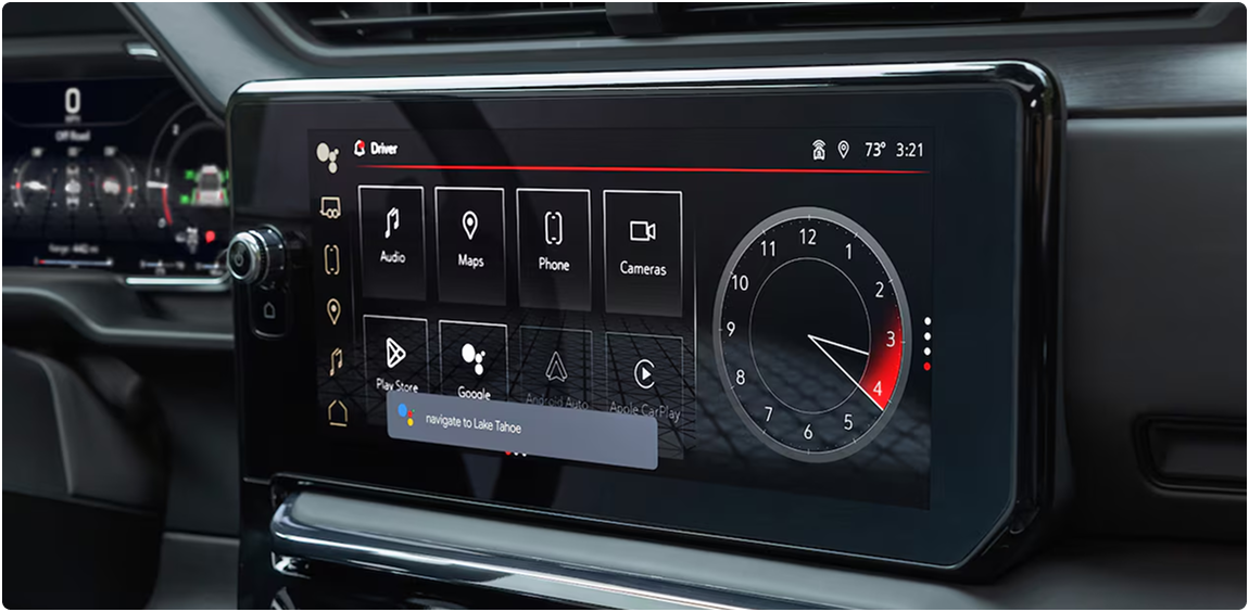 GMC Sierra 1500 center touchscreen showing app icons beside an analog clock