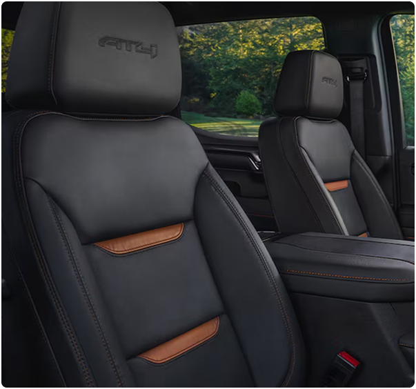 Black leather AT4 front seat with orange accents and an embossed AT4 headrest