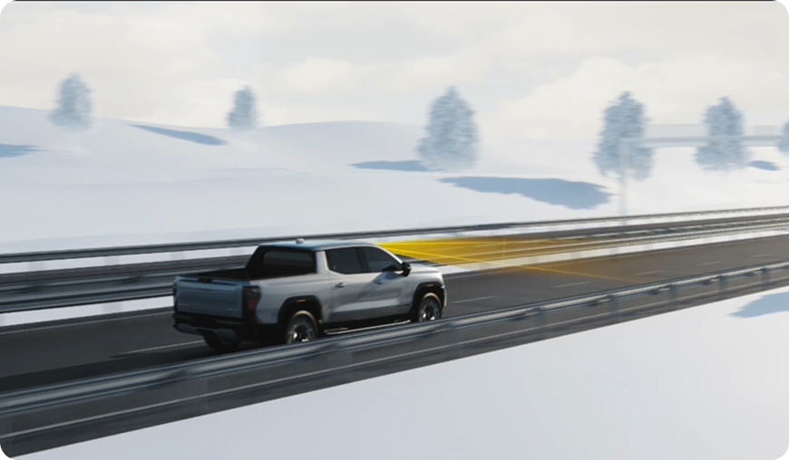 Illustration of a silver GMC truck on a snowy highway, with a sensor beam pointing at the road ahead