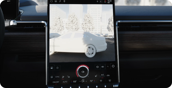 Center touchscreen showing a rear camera view of a white car behind the vehicle