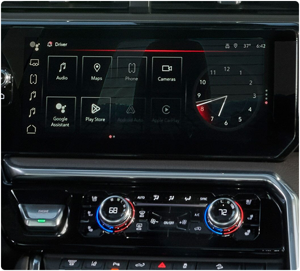GMC Sierra HD center touchscreen showing app icons and an analog clock above the climate controls