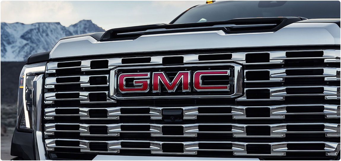 Close-up of the chrome Denali grille with red GMC lettering