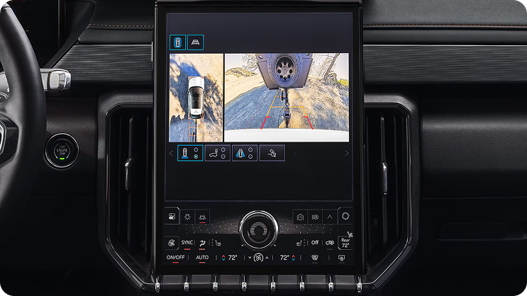 Center touchscreen showing a rear camera view with a guideline leading to a trailer coupler