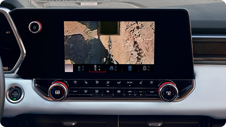 Center touchscreen showing a close-up overhead camera view of the trailer hitch