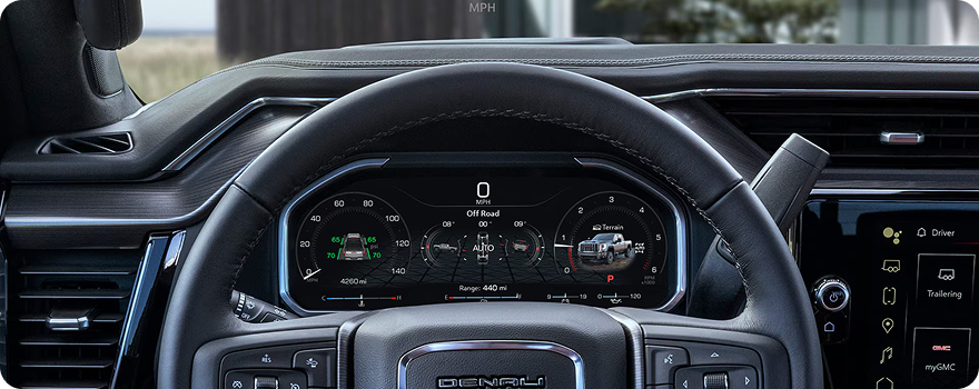 Digital Driver Information Center behind the steering wheel of a GMC Sierra HD Denali
