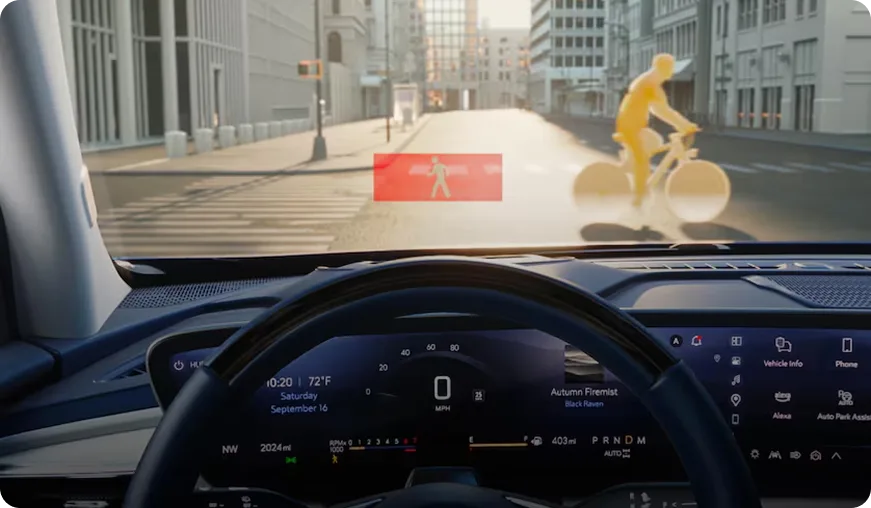 Head-Up Display alerting the driver to a bicyclist detected ahead of the Enclave