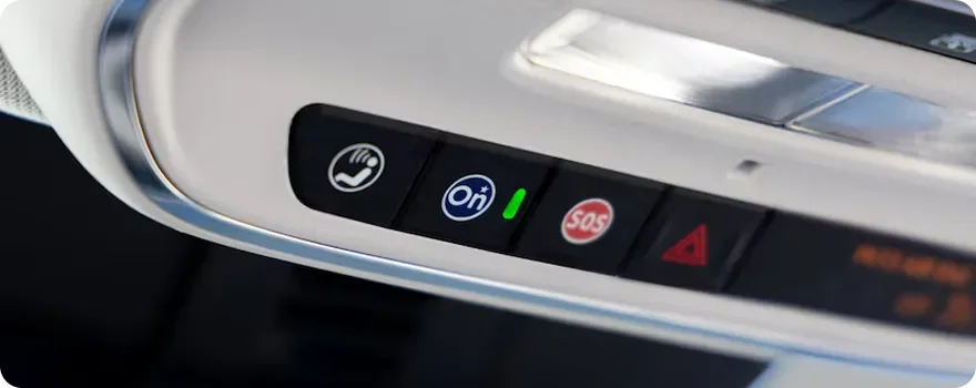 Close-up of the Enclave overhead console with the OnStar buttons