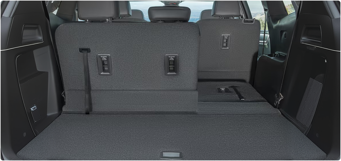 GMC Acadia cargo area with part of the third row folded flat