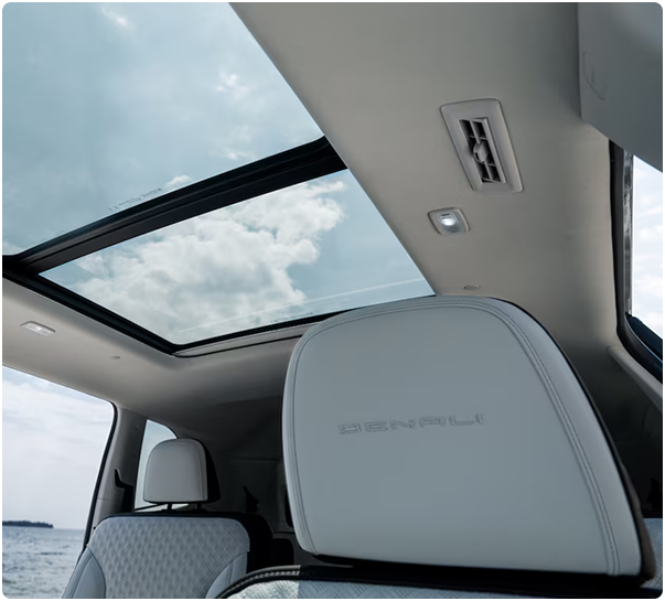 Panoramic sunroof above a Denali-embossed headrest inside the Acadia