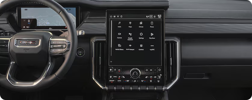 GMC Acadia steering wheel beside the 15-inch diagonal portrait infotainment touchscreen
