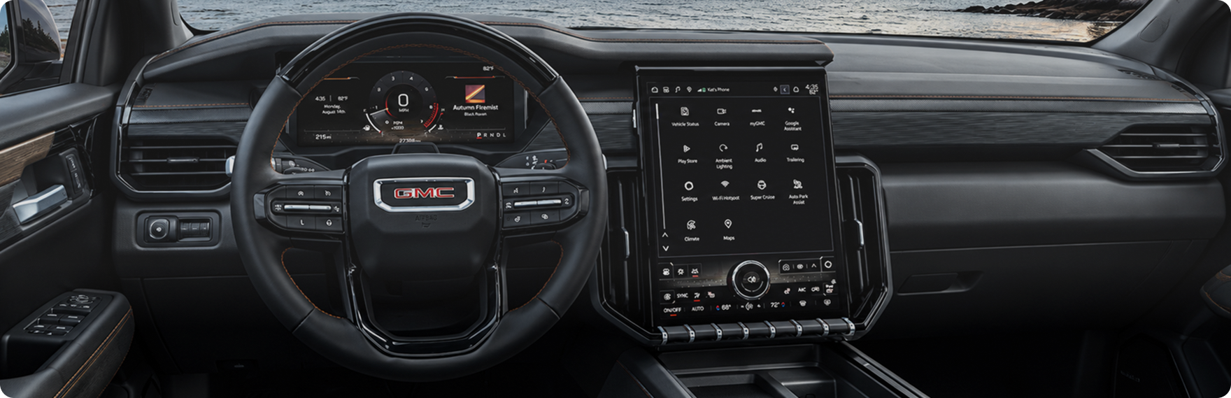 GMC Acadia dashboard with the digital driver display, steering wheel and portrait center touchscreen