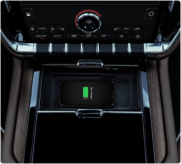 Phone on the wireless charging pad in the GMC Yukon center console below the climate controls