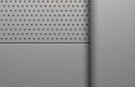 Close-up of light gray perforated leather in the Yukon Denali