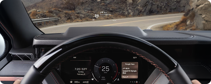 Driver’s view in a GMC Yukon with the Head-Up Display projecting speed and navigation onto the windshield