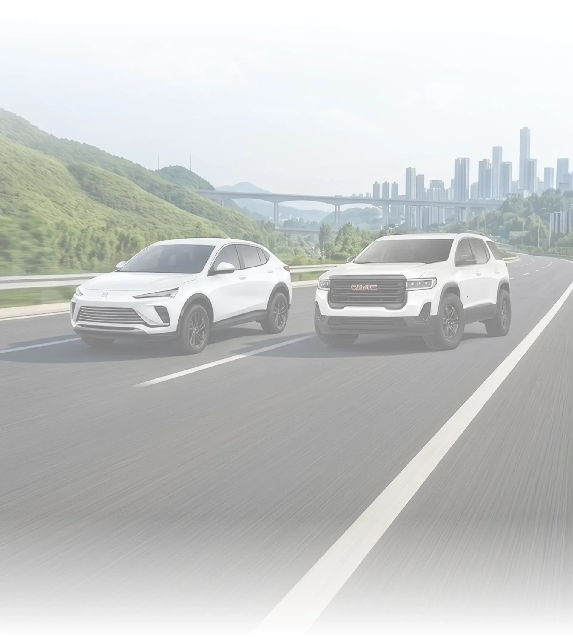 Faint backdrop of a white Buick crossover and a white GMC SUV driving toward a city skyline